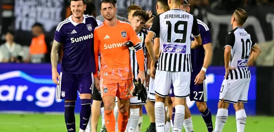 Anderlecht and PAOK players interacting on field