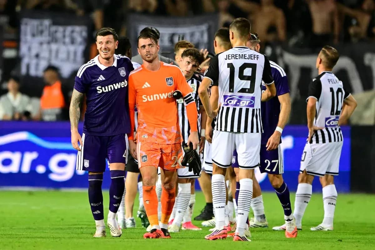 Anderlecht and PAOK players interacting on field