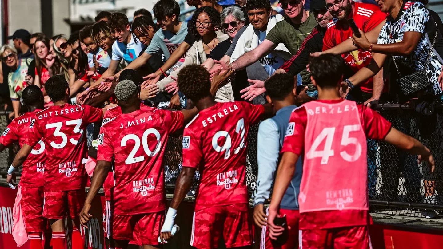 Players celebrating with fans after match