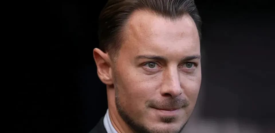 Man in suit looking directly at the camera