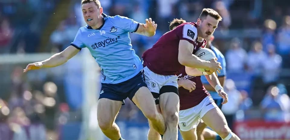 Dublin and Galway players contesting for possession during match