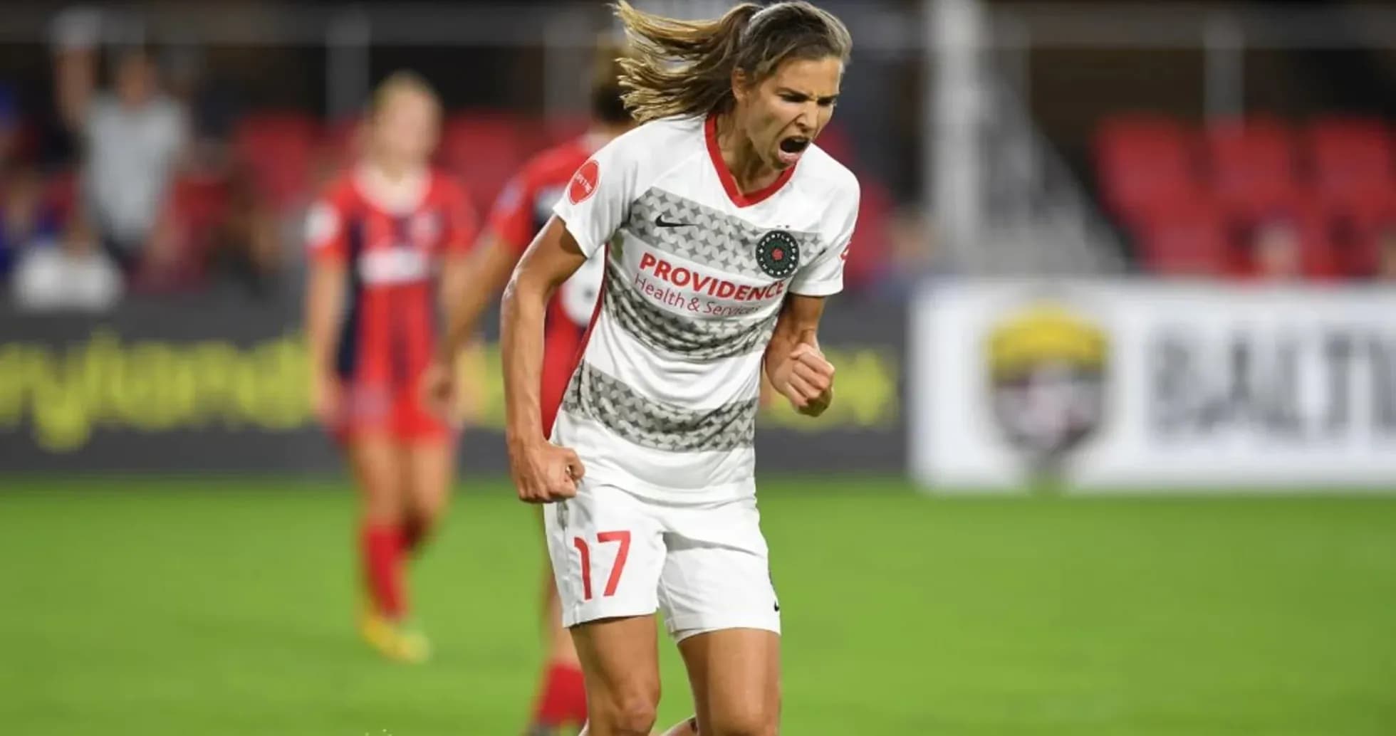 Player celebrating goal during NWSL match