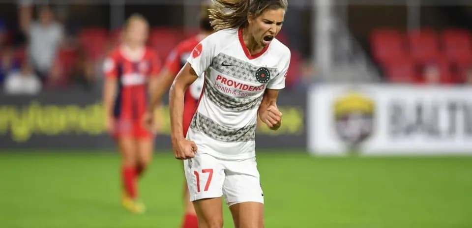 Player celebrating goal during NWSL match