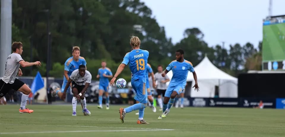 Player with ball during Sporting JAX match