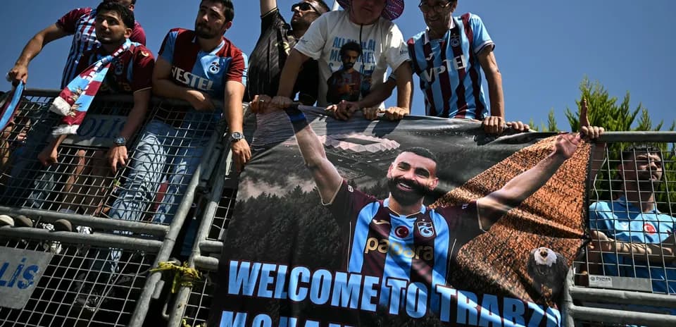 Fans holding welcome banner for Mohammed in Trabzon