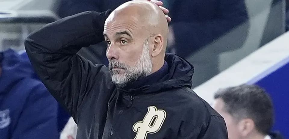 Coach gesturing while watching the match from sidelines
