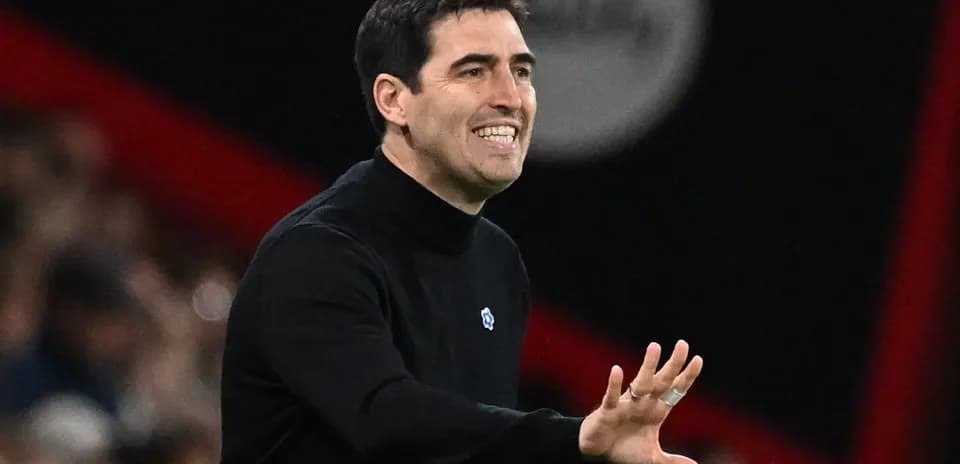 Coach gesturing during a match on the sideline