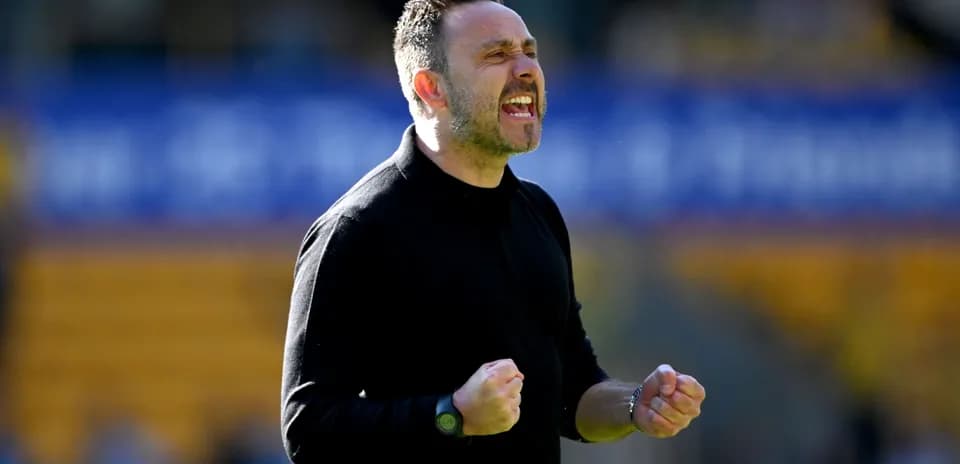Coach celebrating passionately during a match