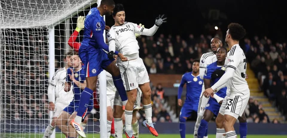 Chelsea player heading the ball during match