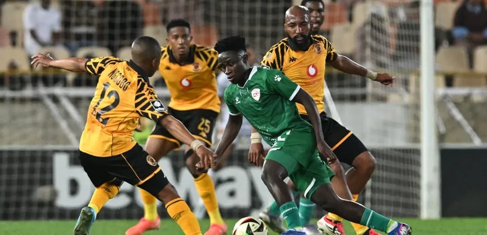 Player dribbling past opponent during football match