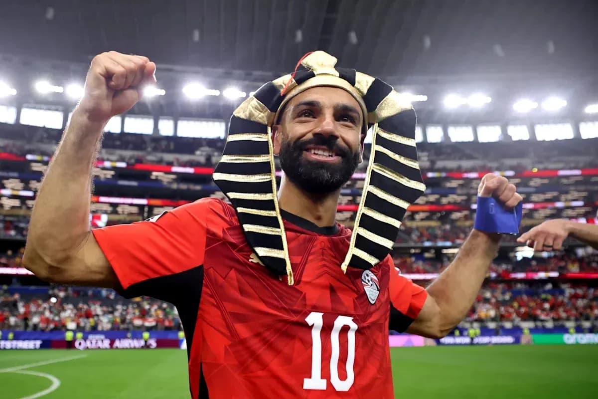 Player celebrating with pharaoh headdress after match
