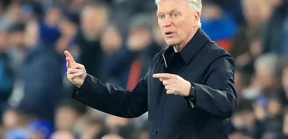 Manager gesturing during a football match