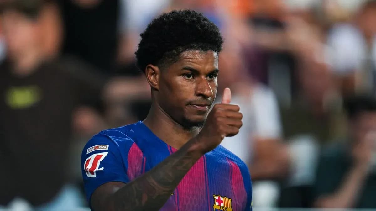 Player giving thumbs up during match celebration