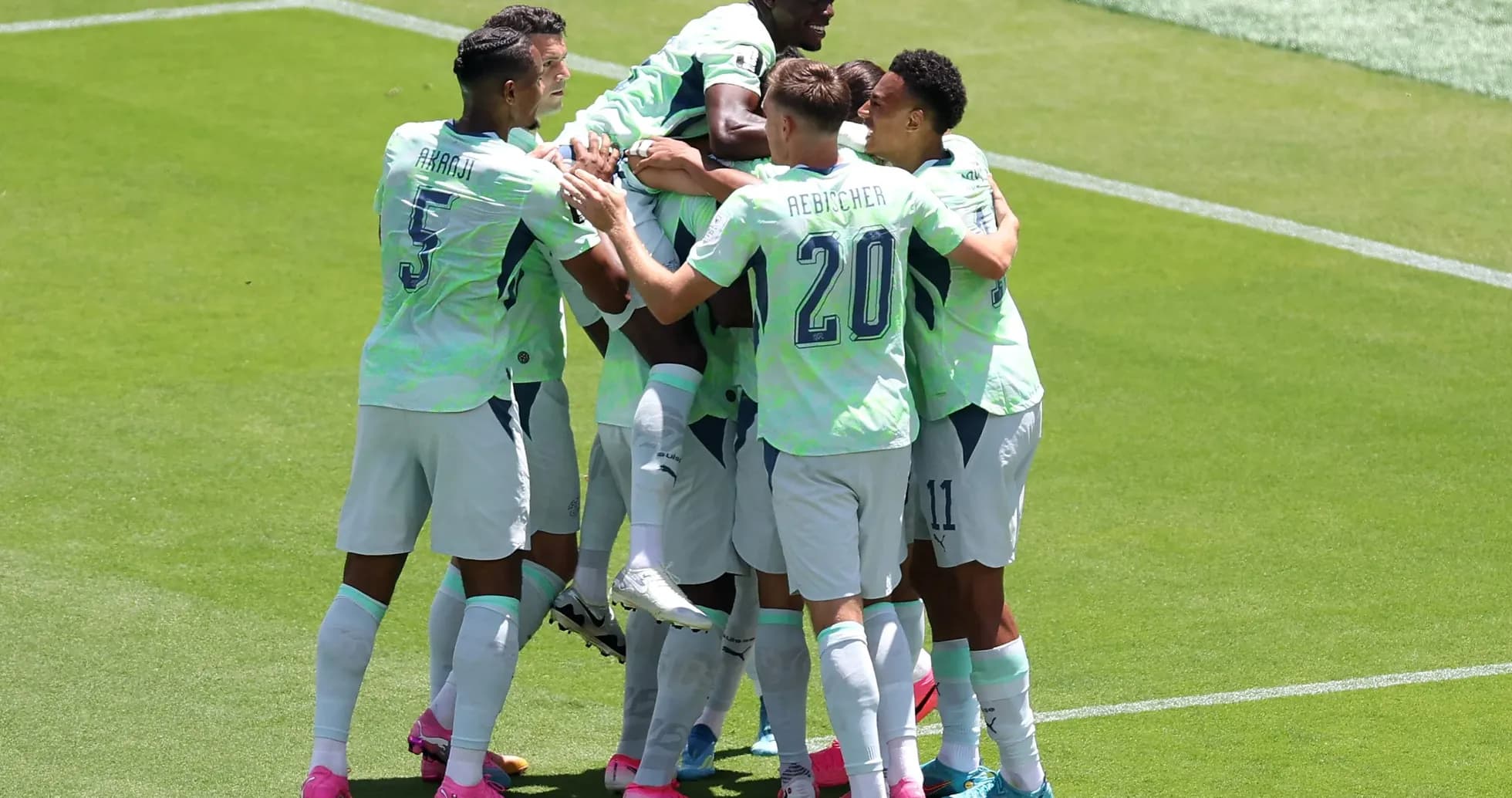 Players celebrating a goal during Qatar vs Switzerland