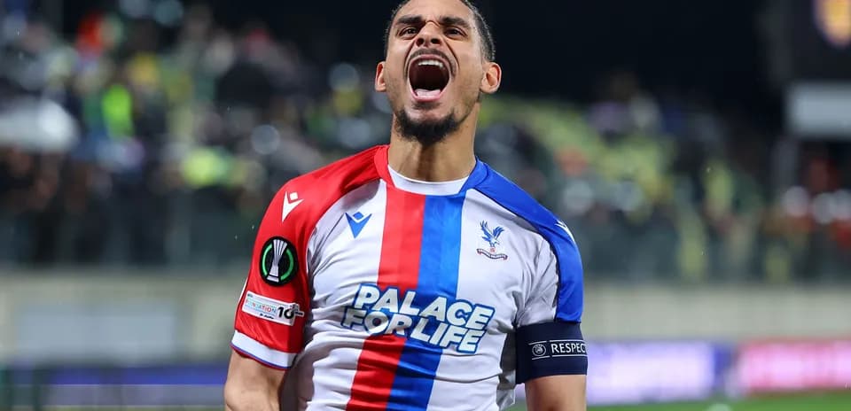 Player celebrating in Crystal Palace jersey on pitch