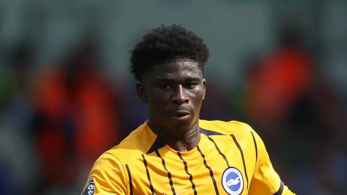 Player in yellow kit running on the field
