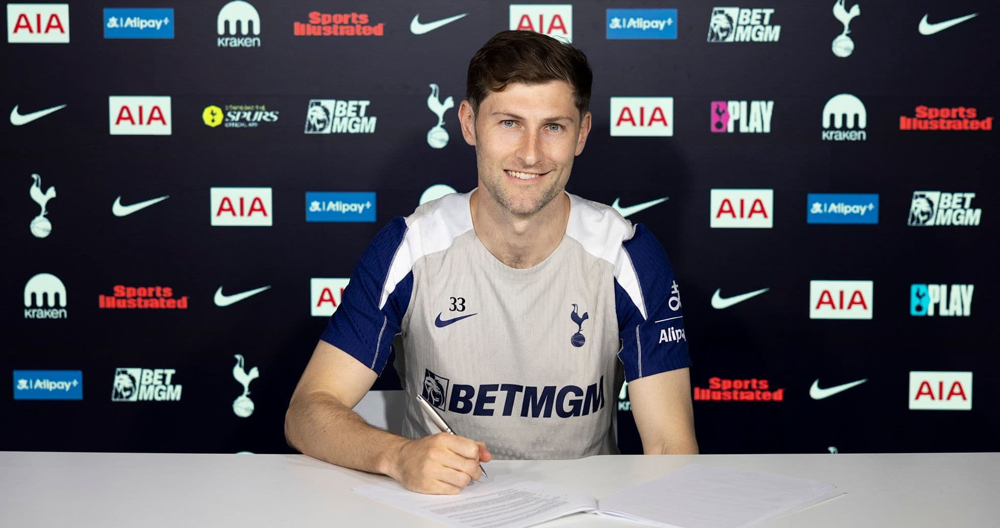 Player signing contract at Tottenham Hotspur announcement