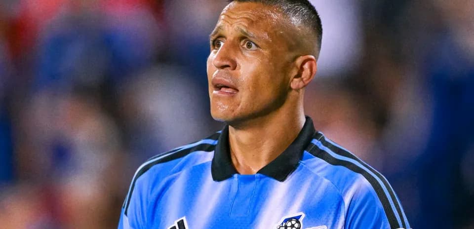 Player in blue jersey looking towards the field