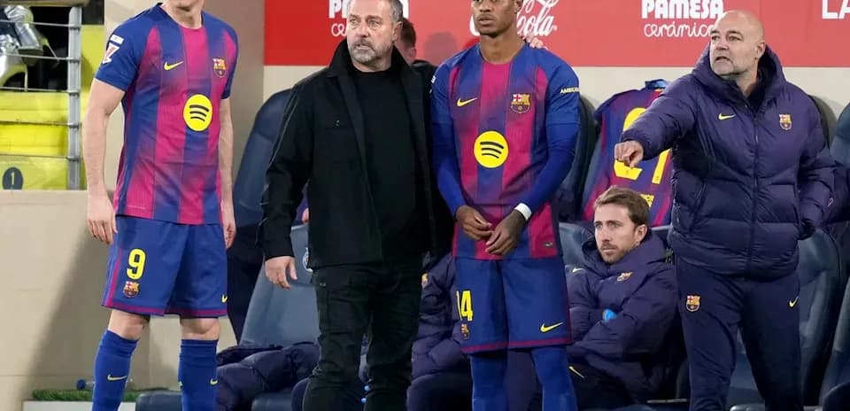 Barcelona players and coaching staff during match substitution