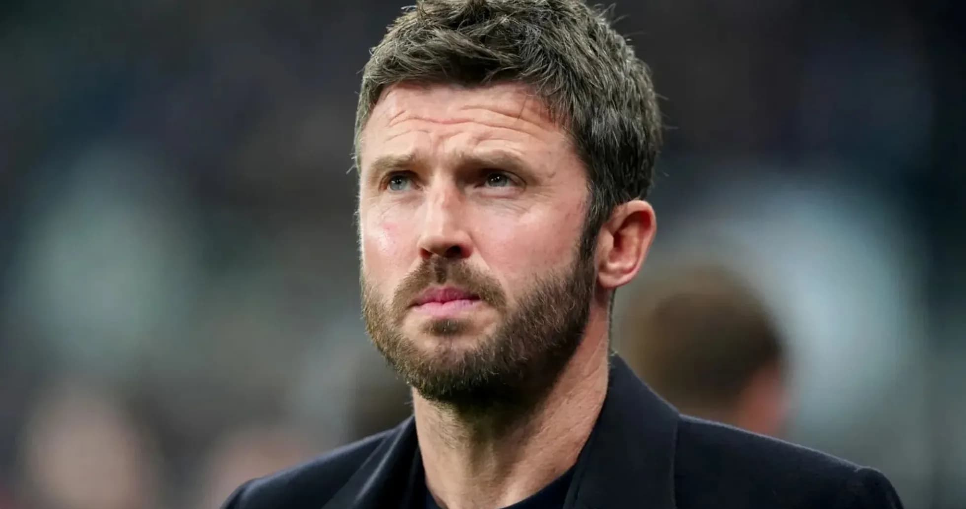 Coach looking thoughtfully during match