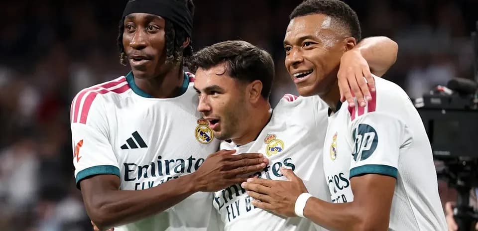 Real Madrid players celebrating together on the field