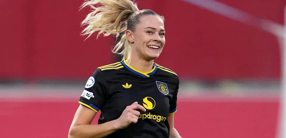 Female soccer player celebrating during a match