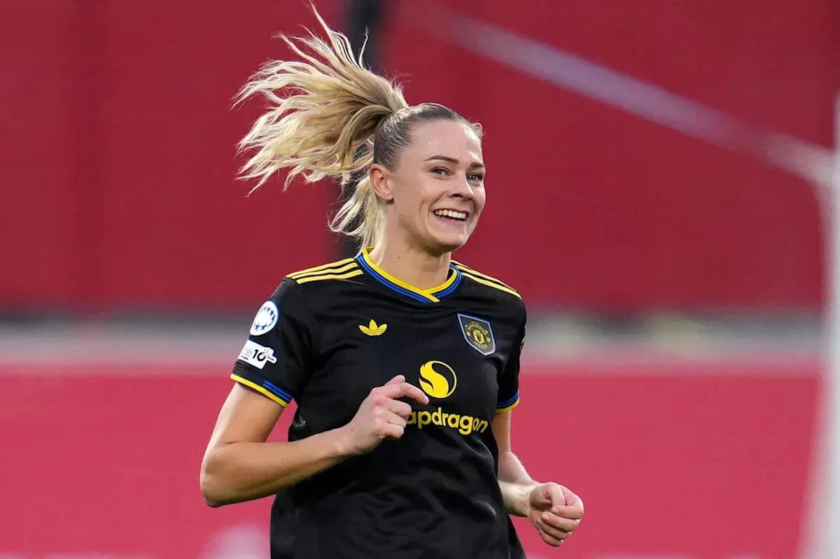 Female soccer player celebrating during a match