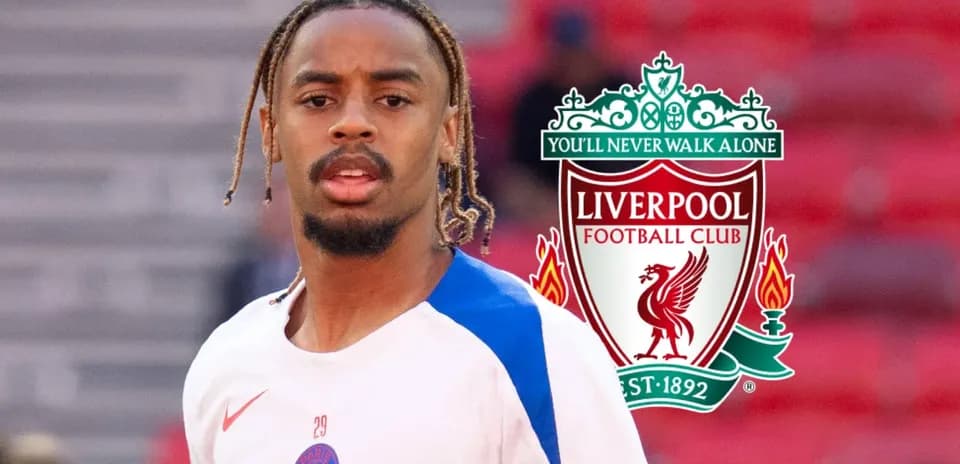 Player warming up with Liverpool logo in background
