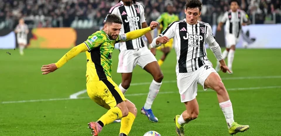 Players contesting the ball during a football match