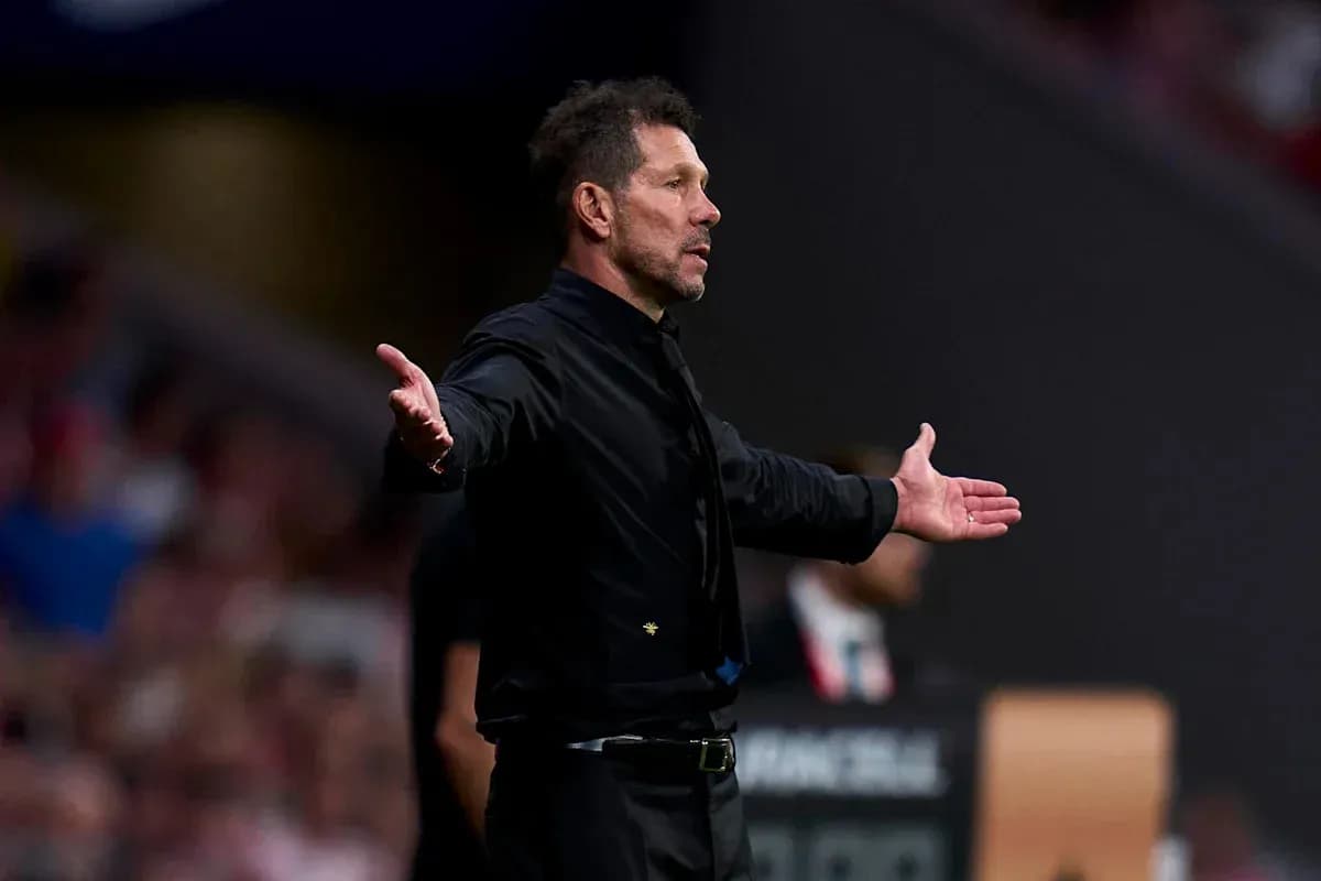Coach gesturing on the sidelines during match