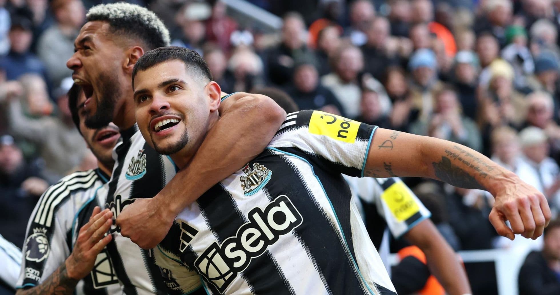 Newcastle players celebrating a goal during match