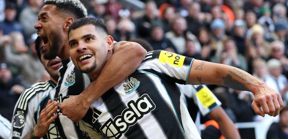Newcastle players celebrating a goal during match