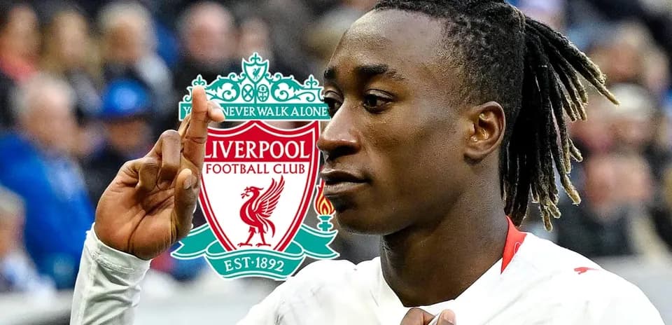 Player gesturing with Liverpool logo in background