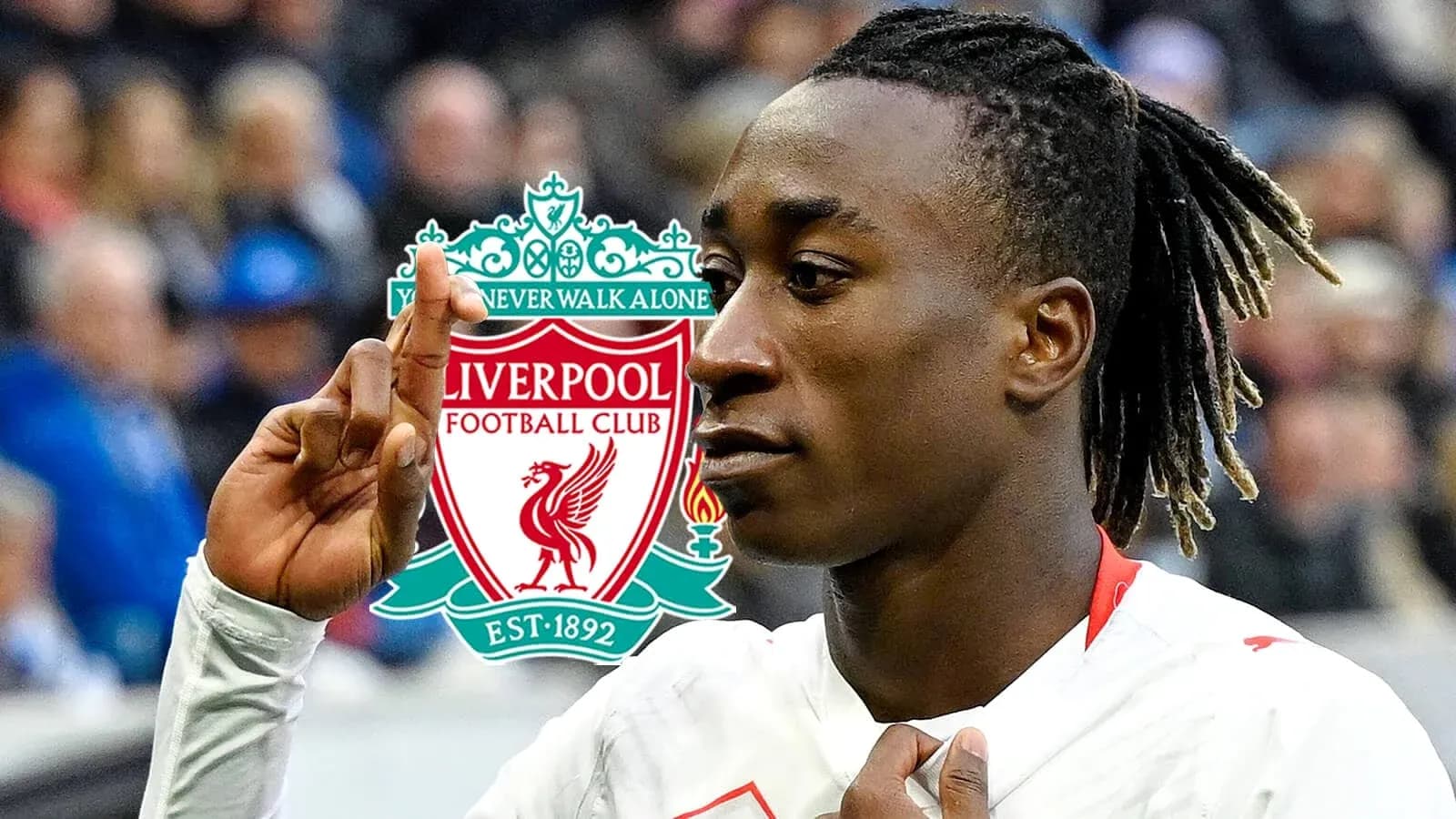 Player gesturing with Liverpool logo in background