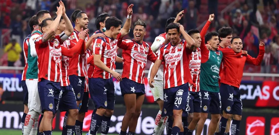 Chivas players celebrating victory on the field