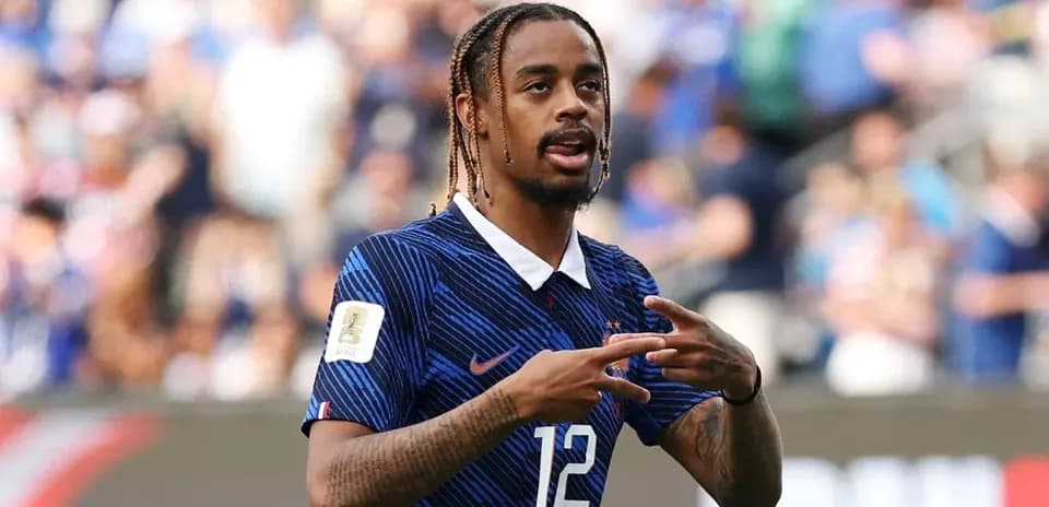 Player gesturing during football match on field