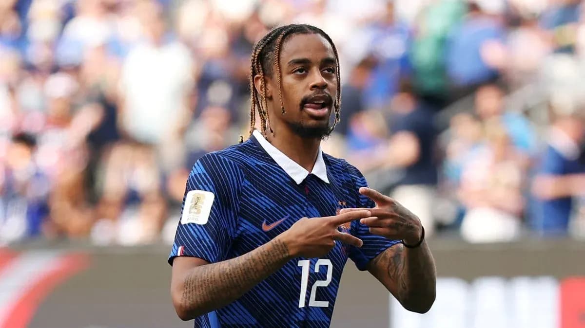 Player gesturing during football match on field