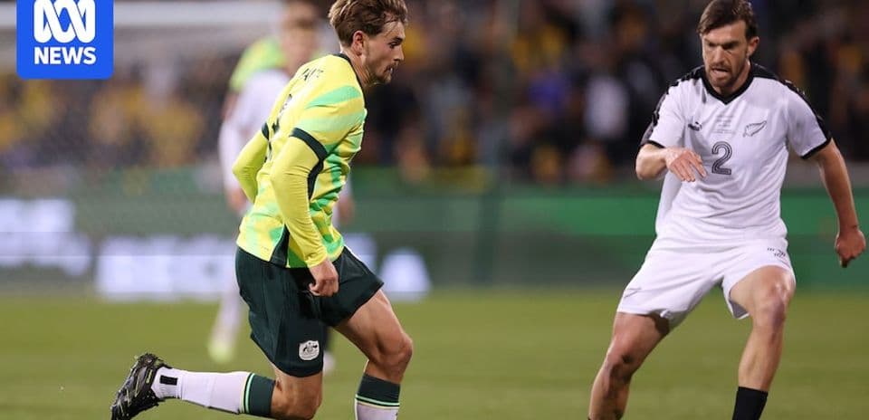 Player dribbling the ball during Australia vs New Zealand match