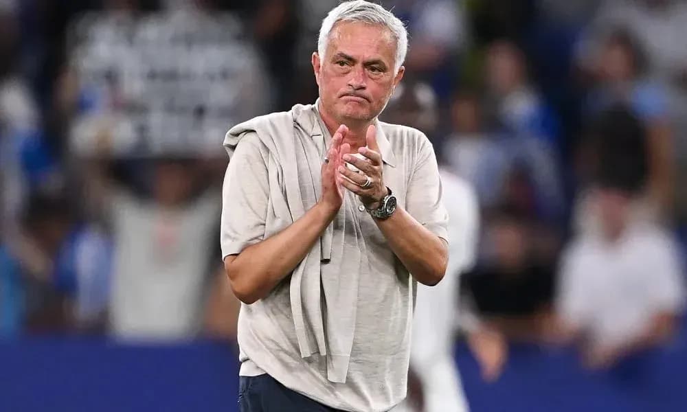 Manager clapping to fans after match conclusion