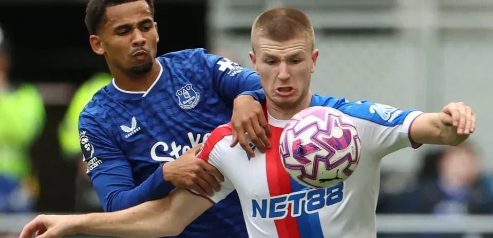 Two players battling for the ball during match
