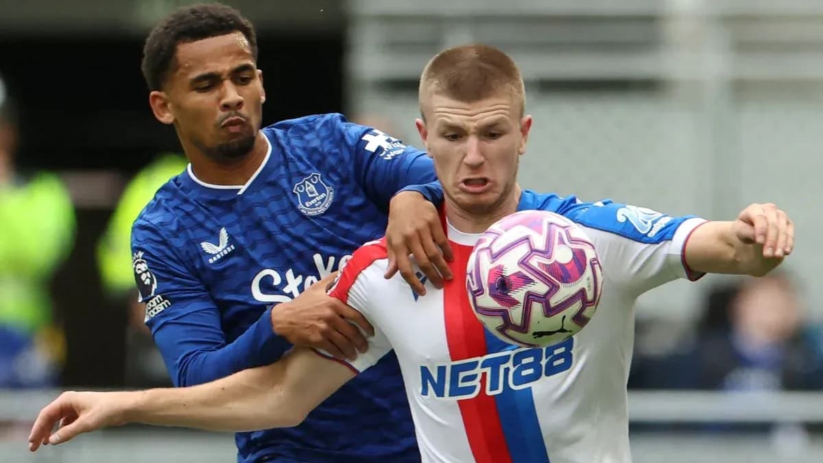 Two players battling for the ball during match