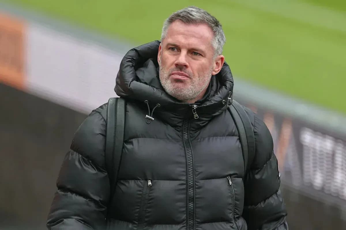 Man in black puffer jacket walking at stadium