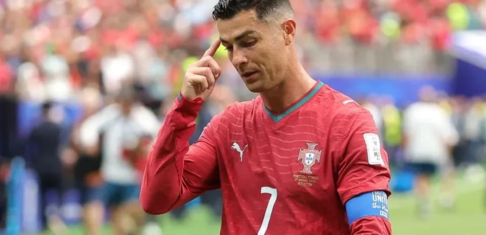 Cristiano Ronaldo during match, touching his head