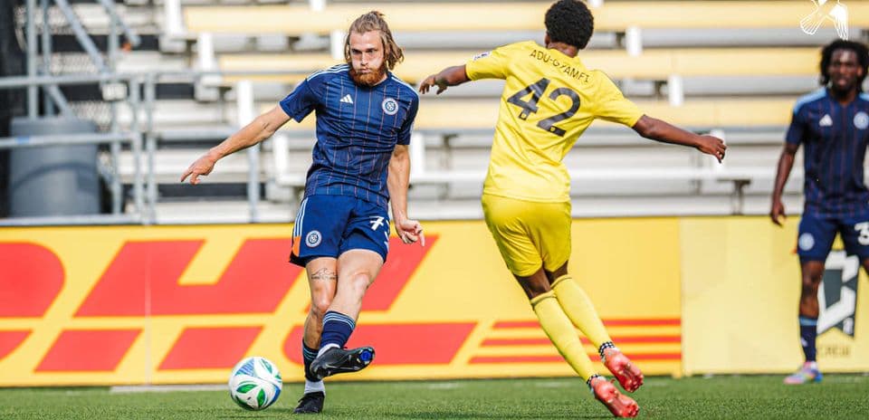 Player passing the ball during NYC II match