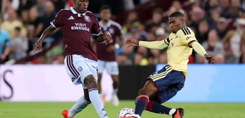 Players from Aston Villa and Arsenal contesting the ball