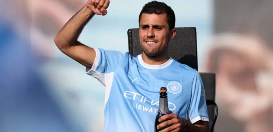 Player celebrating with champagne after match