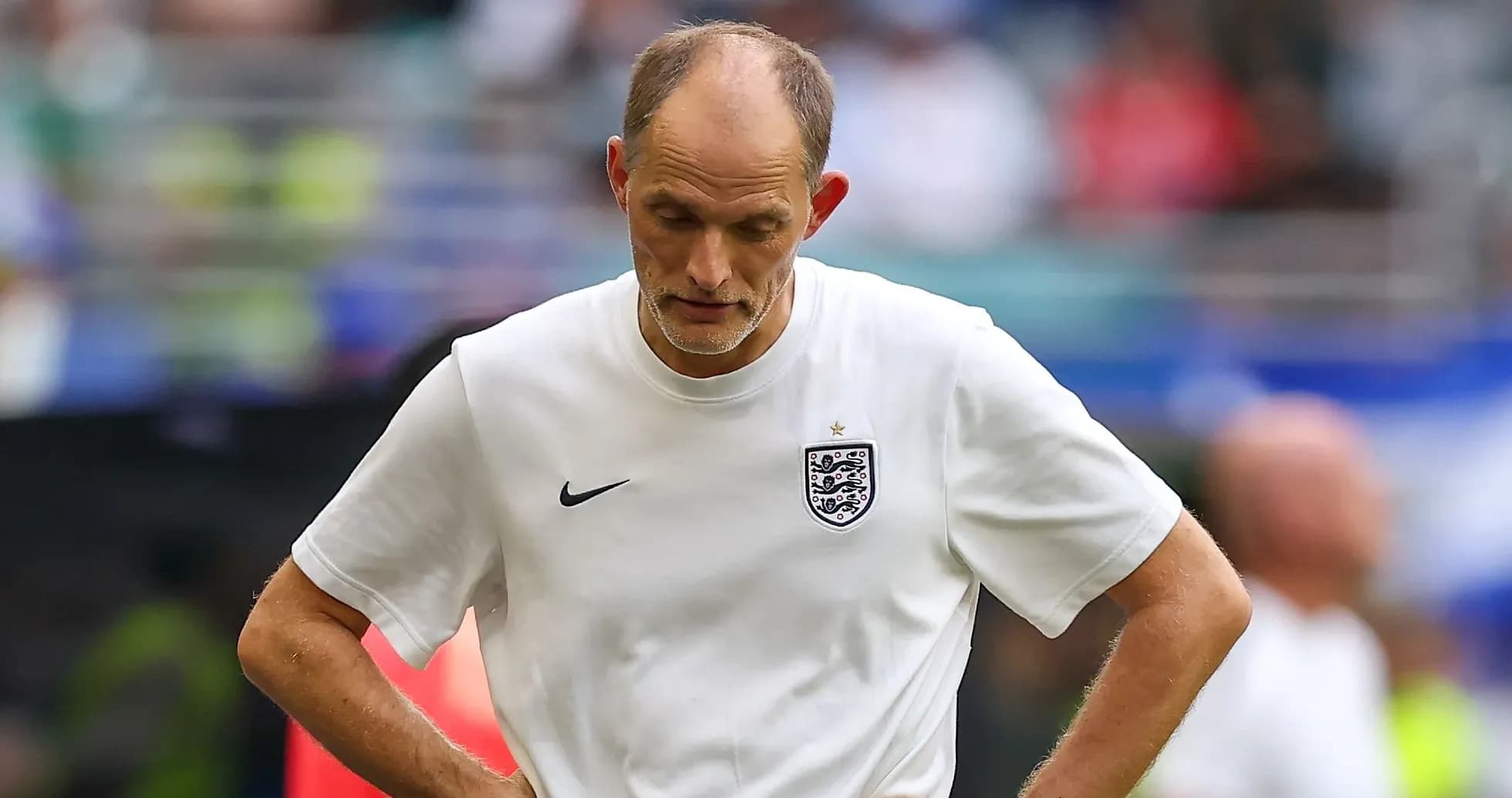 Coach looking down during a match
