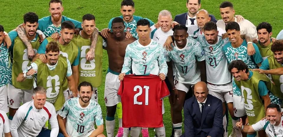 Portugal national team celebrating with jersey after match