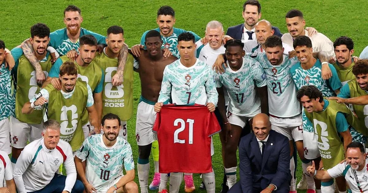 Portugal national team celebrating with jersey after match