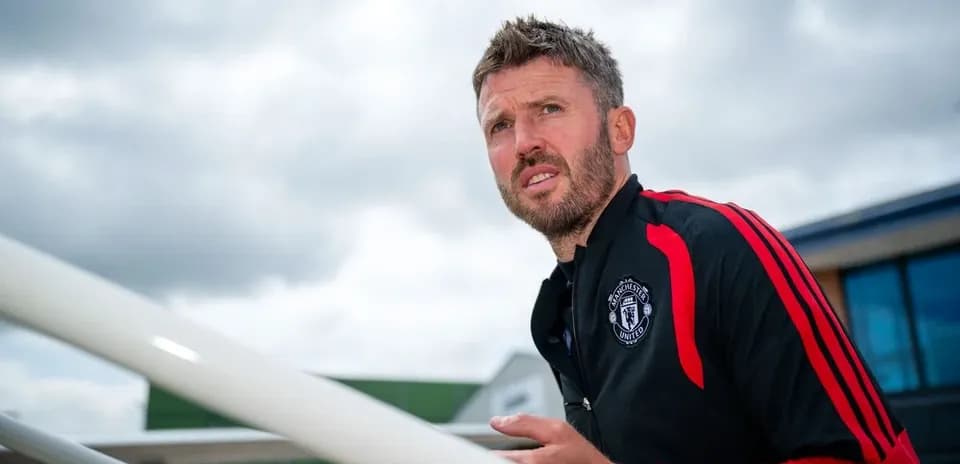 Manchester United coach on training ground steps